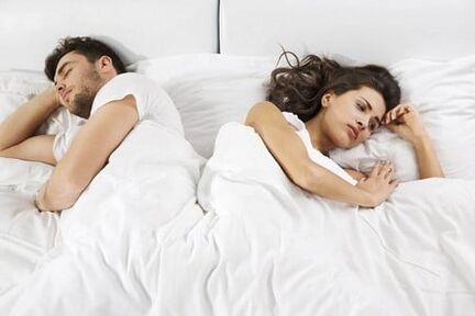 A man with poor power and a woman irritated in bed